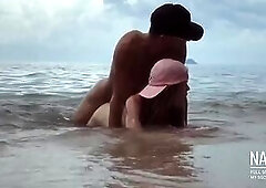 Hottest romantic risky sex in the sea waves on the public beach