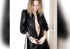 Tattooed hands slip down her exposed abdomen slow ?
