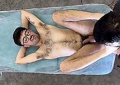 young hairy guy suffering during hair removal