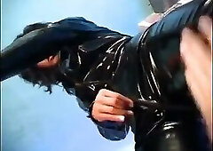 Female domina in latex Simone Style suit gets anal riding and jizz drinking