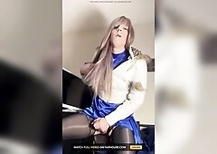 Jess with lengthy blond hair, chavy whit puffer jacket, lengthy sleeve satin blue suit, ebony satin strap and ebony nylons rides her sex tool untill t