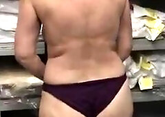 A woman is masturbating in a lingerie warehouse