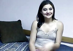 Brunette beauty puts condom on a green plantain and fuck herself