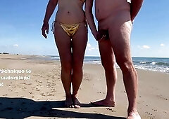 Slut makes fun of her husband on the beach