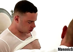 Businessman in White Suit Gives Intense Handjob to Muscular Man