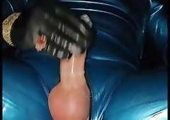 Blue Latex Catsuit And Leather Gloves