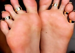 Brunette with foot fetish rubs big dick with her feet in POV